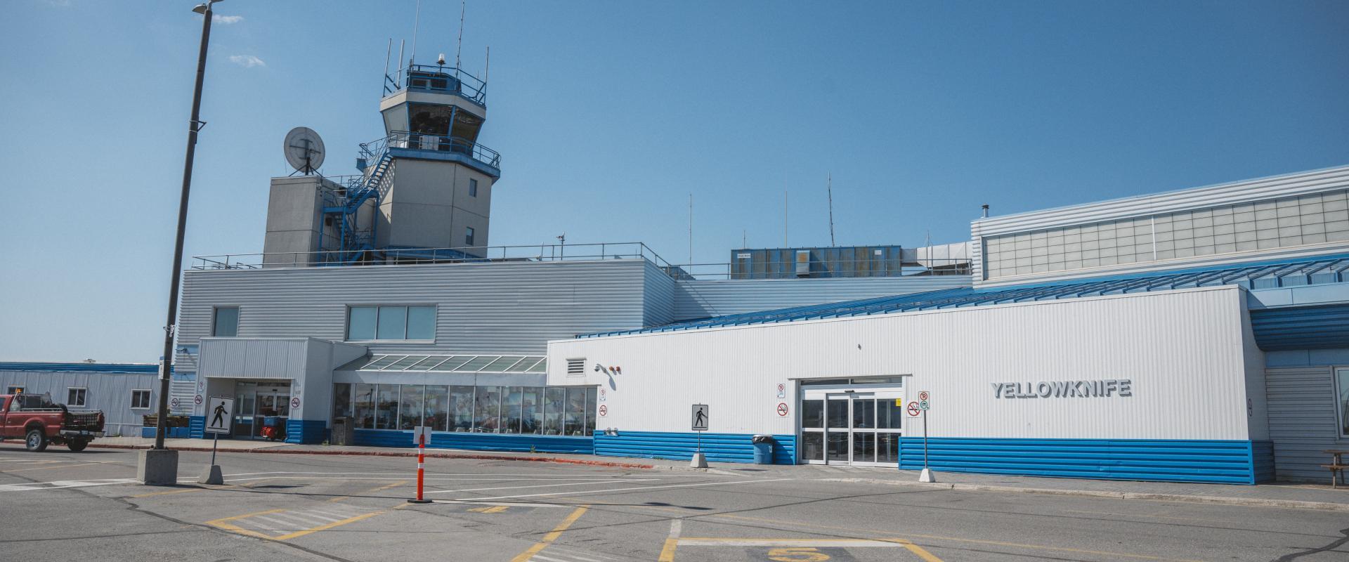 The image features Yellowknife airport terminal building.